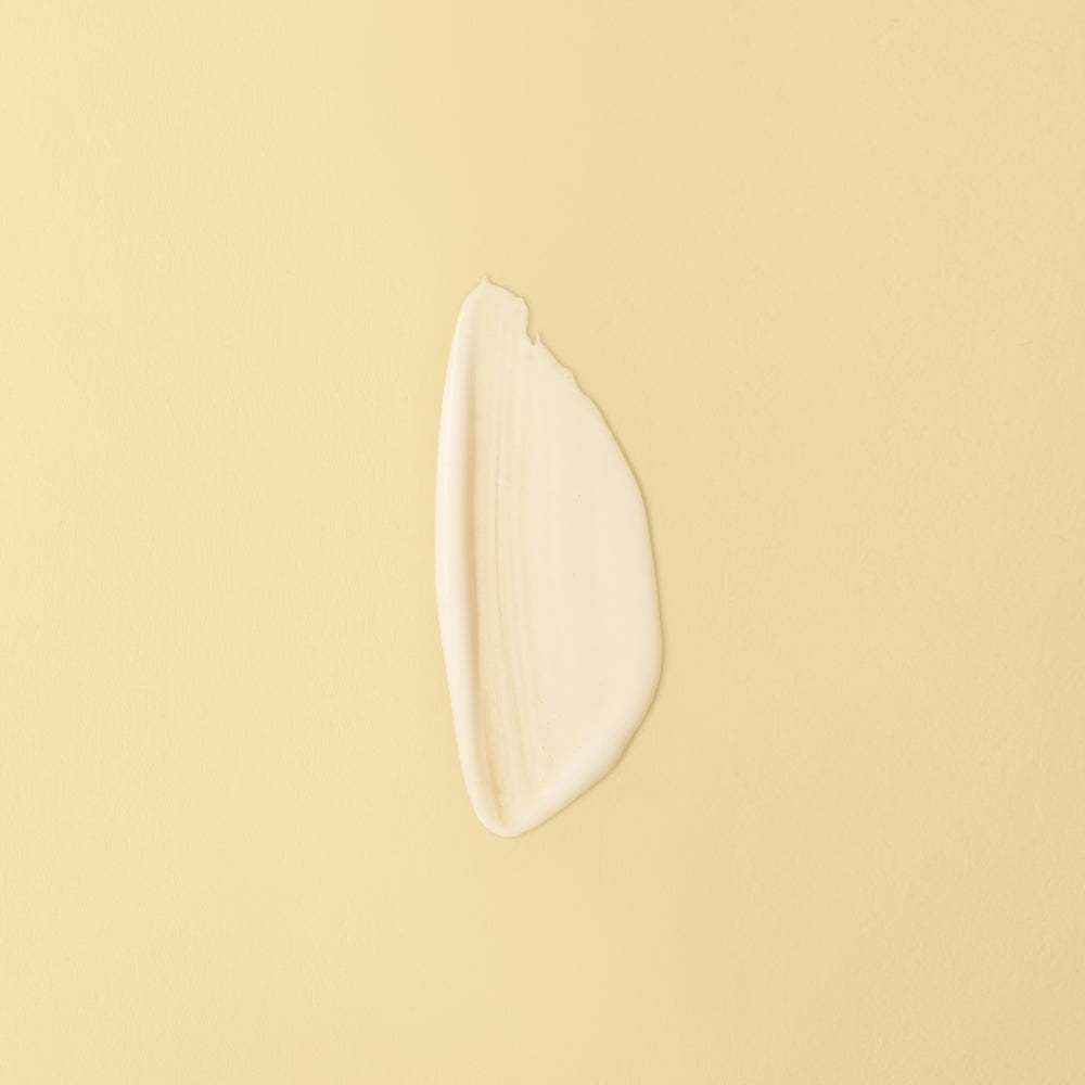 Barrier recovery serum with desert milk and ceramides spread on yellow background